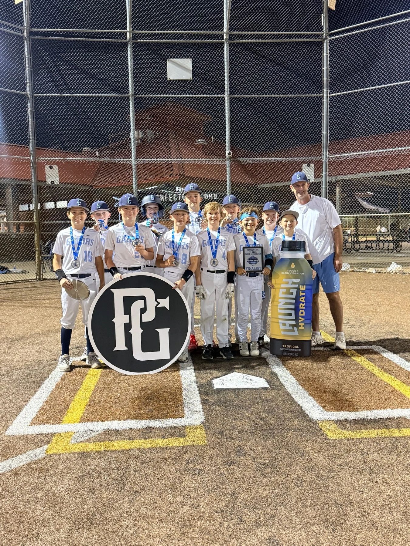 Youth baseball team at the plate after the win