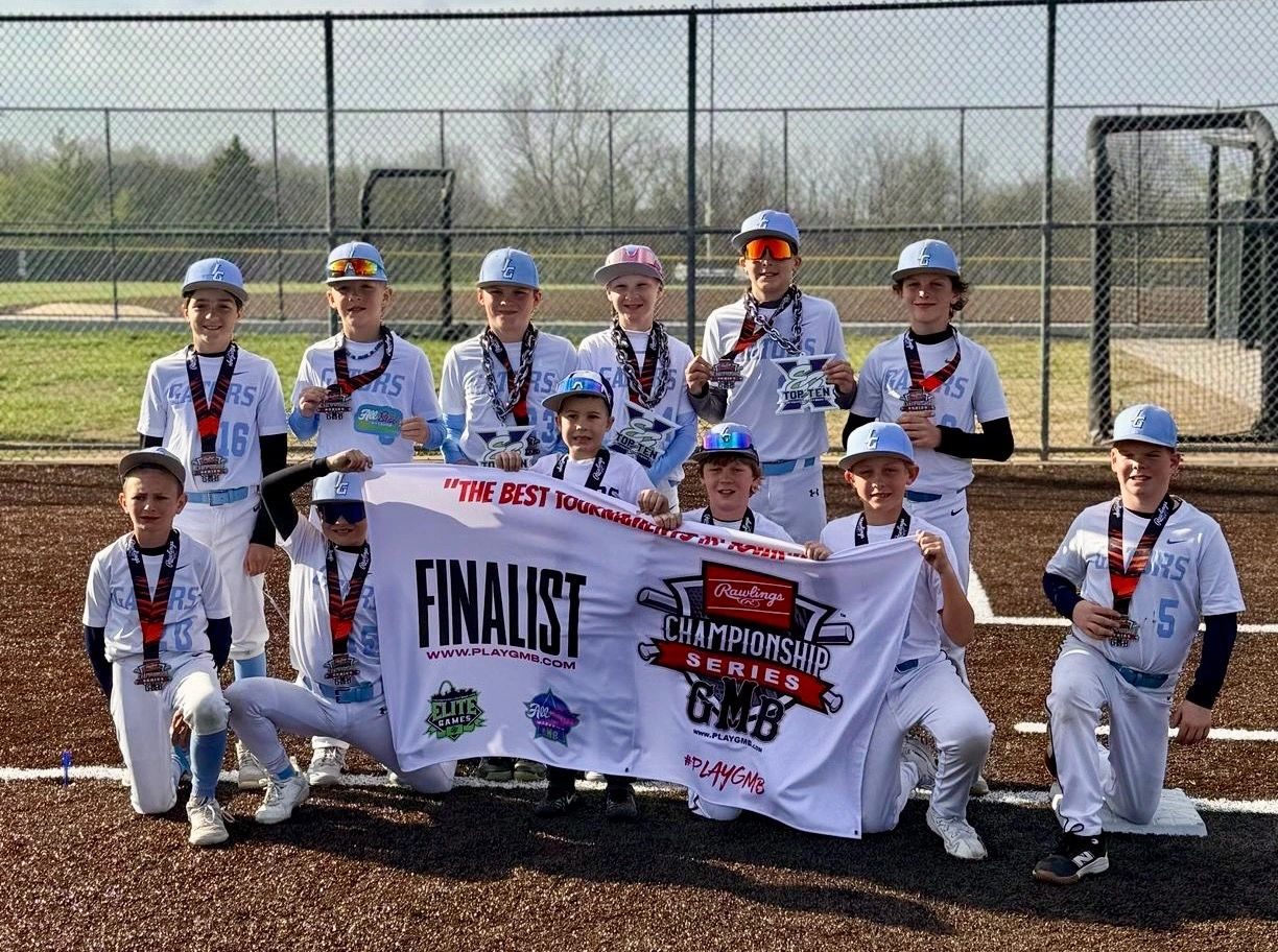 Illinois Gators 11U holding their championship series finalist banner
